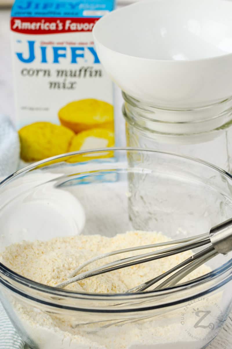 Copycat Jiffy Muffin Mix in a bowl with a whisk