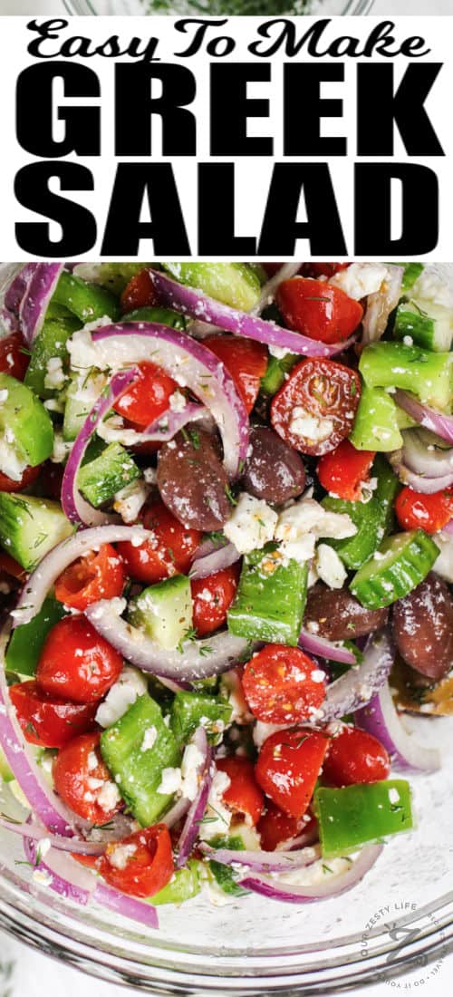 top view of Greek Salad in a glass bowl with a title