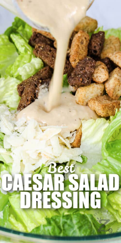 pouring Vinaigrette Caesar Salad Dressing over salad with a title