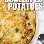 top view of Cheesy Scalloped Potatoes in a dish with writing