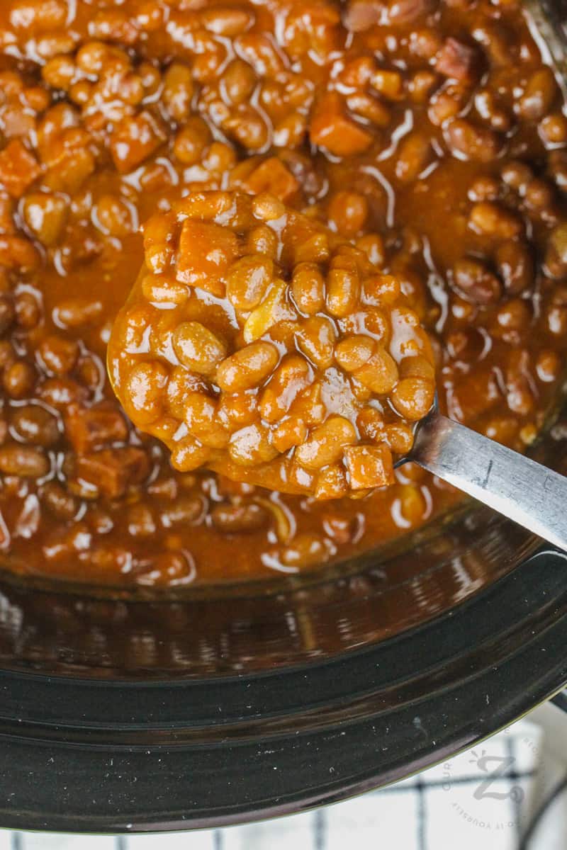 slowcooker with Easy Slow Cooker Baked Beans and a laddle