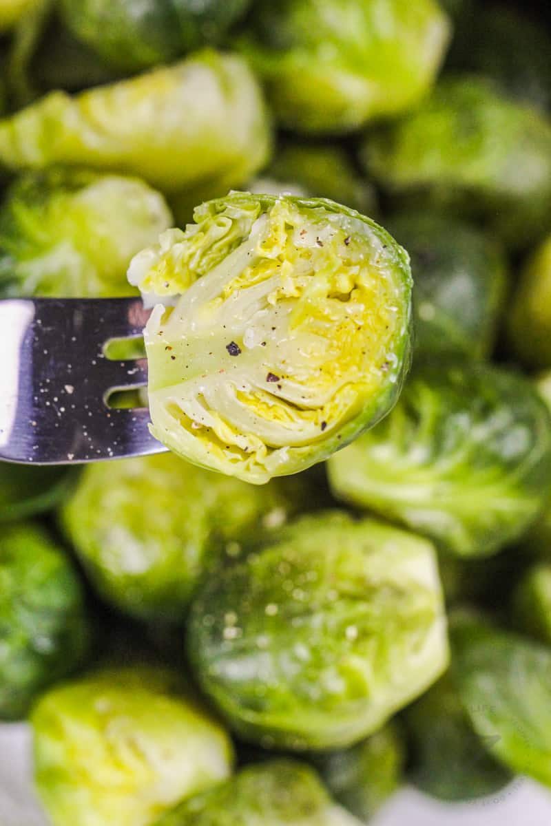 close up of Instant Pot Brussels Sprouts with one on a fork