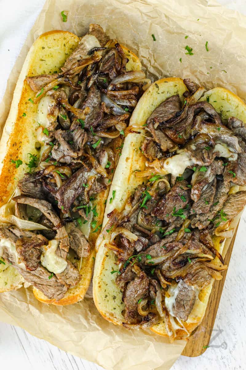 top view of Philly Cheesesteak Sandwich on a cutting board