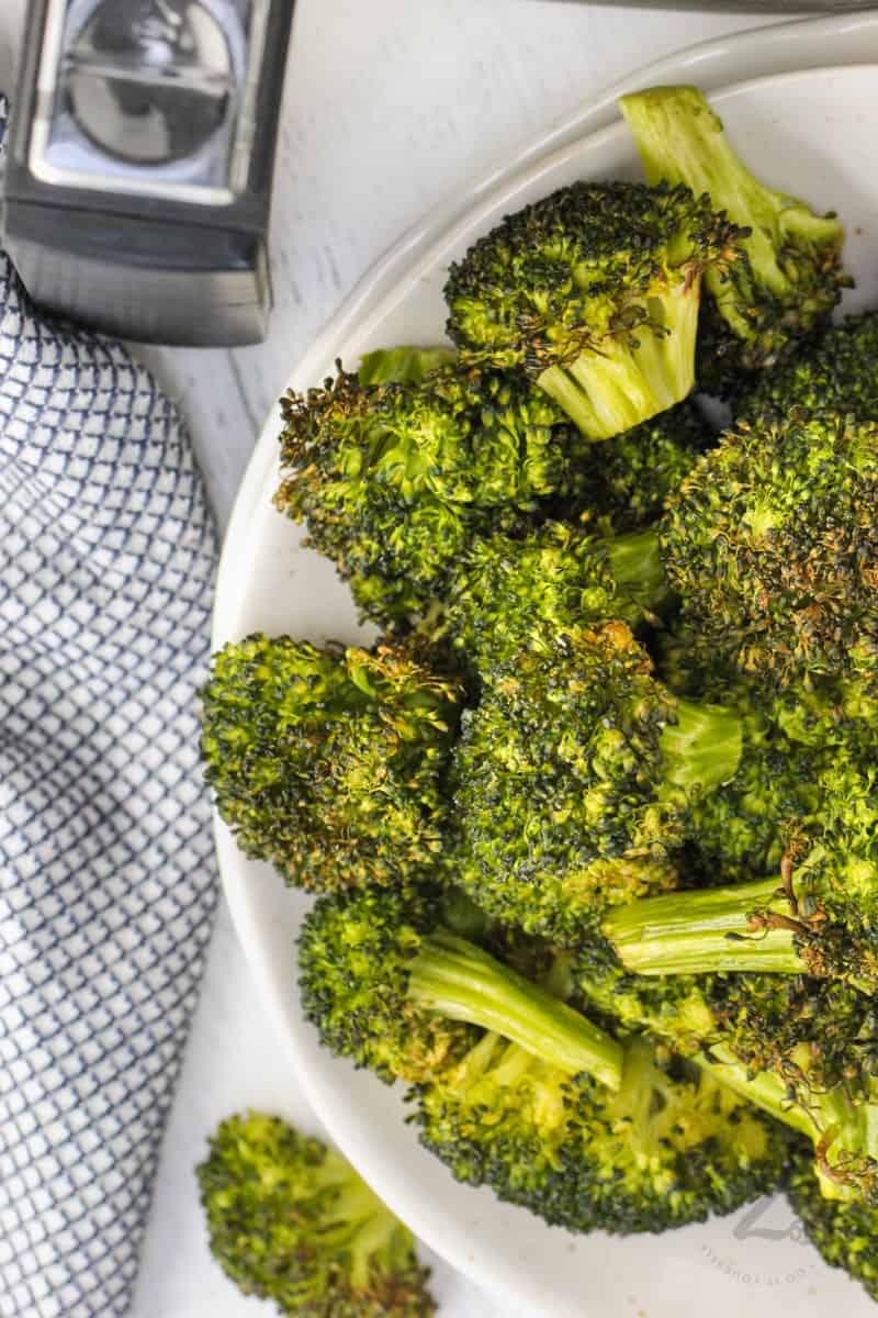 cooked Air Fryer Broccoli on a white plate