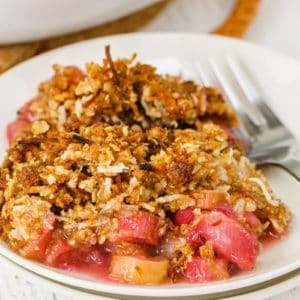 Plate full of Rhubarb Crisp with a fork