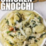 top view of plated Creamy Tuscan Chicken Gnocchi with cheese and writing