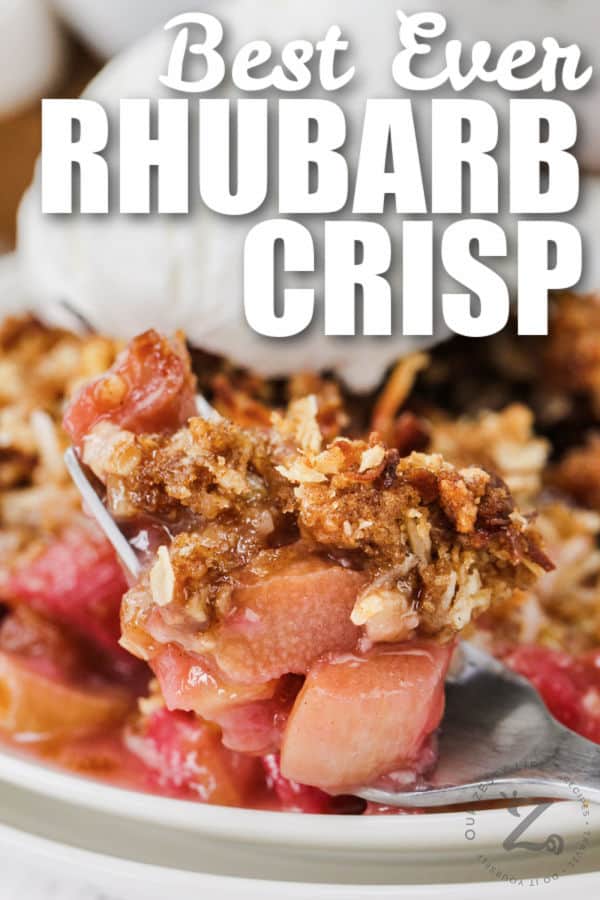forkful of Rhubarb Crisp with plated dish in the background with a title