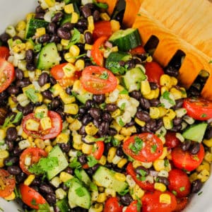 mixing ingredients to make Black Bean Corn Salad