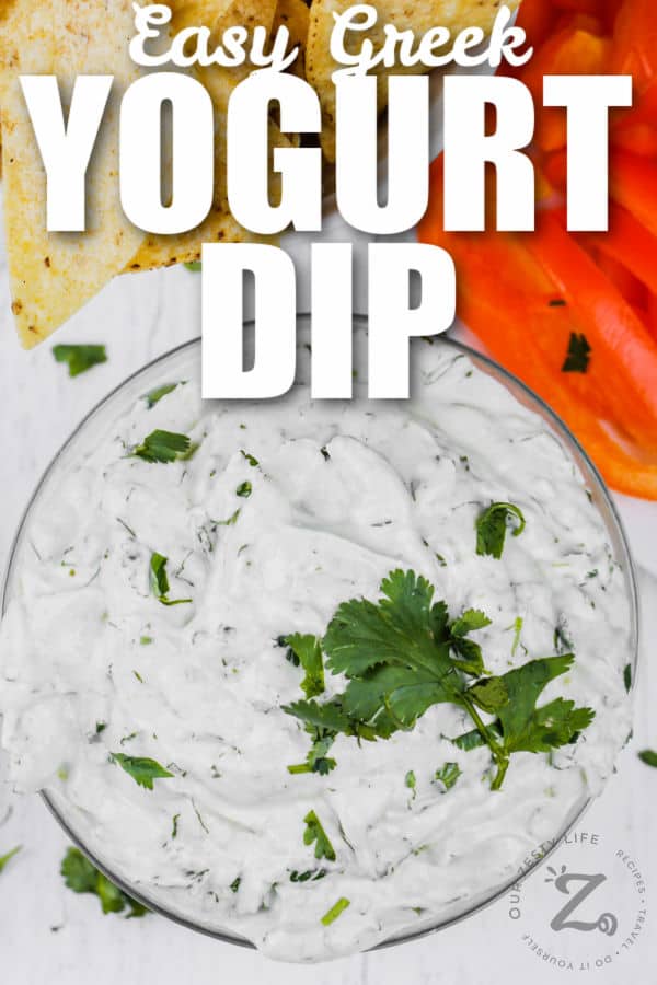 Easy Greek Yogurt Dip in a bowl with chips and peppers with writing