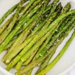close up of Air Fryer Asparagus on a plate with salt