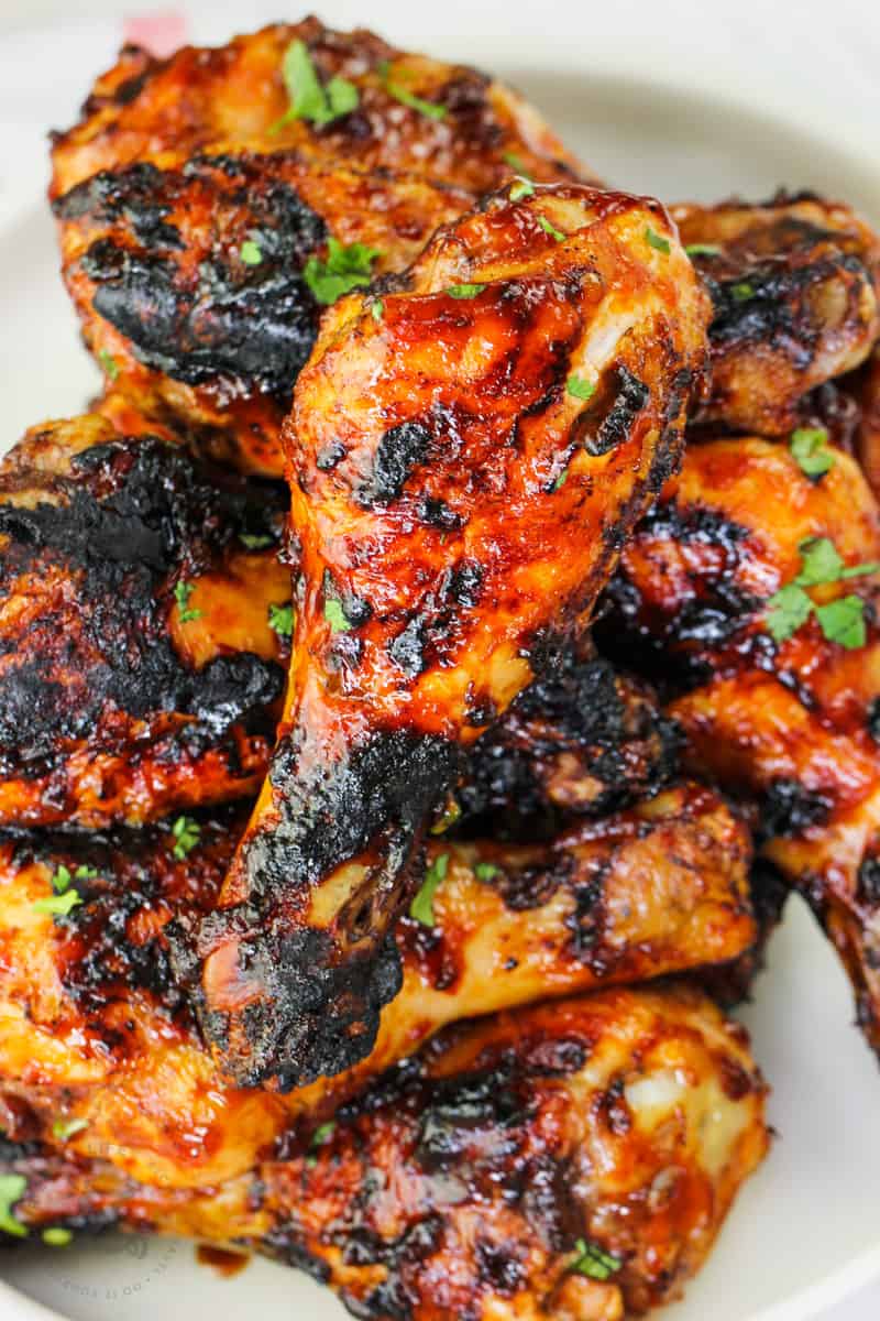 close up of BBQ Drumsticks on a plate