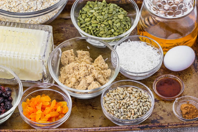 ingredients to make Homemade Granola Bars with Seeds on a baking sheet
