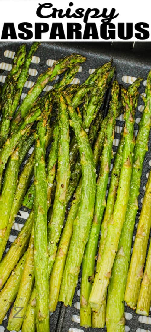 close up of cooked Air Fryer Asparagus with a title