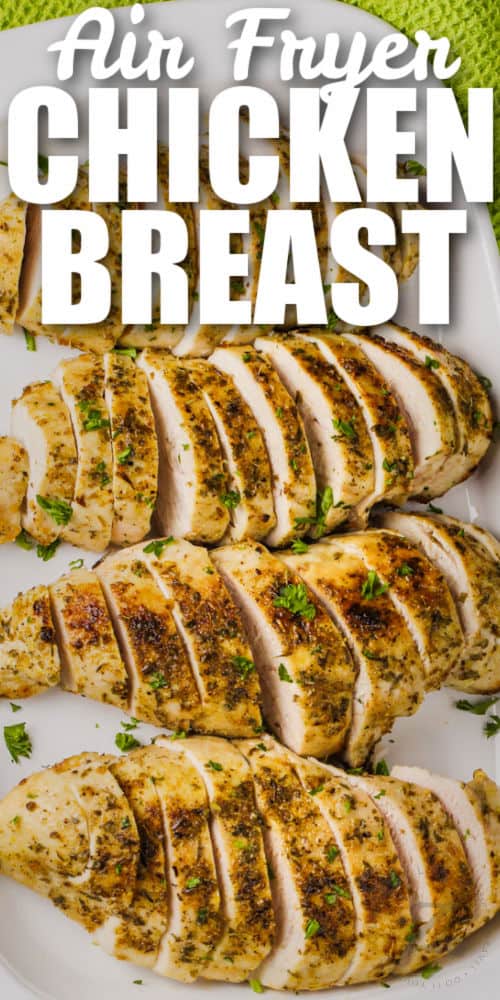 top view of sliced Air Fryer Chicken Breasts on a plate with writing