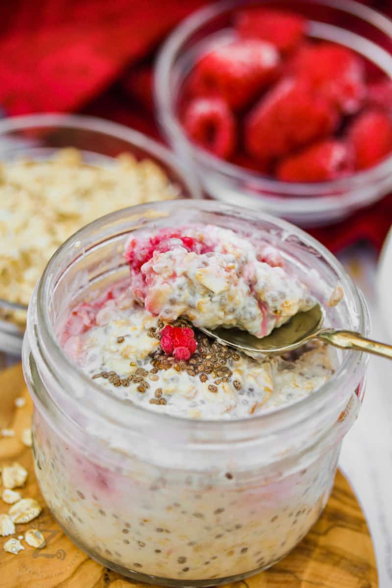 jar of Overnight Oats with Fruit with ingredients around it