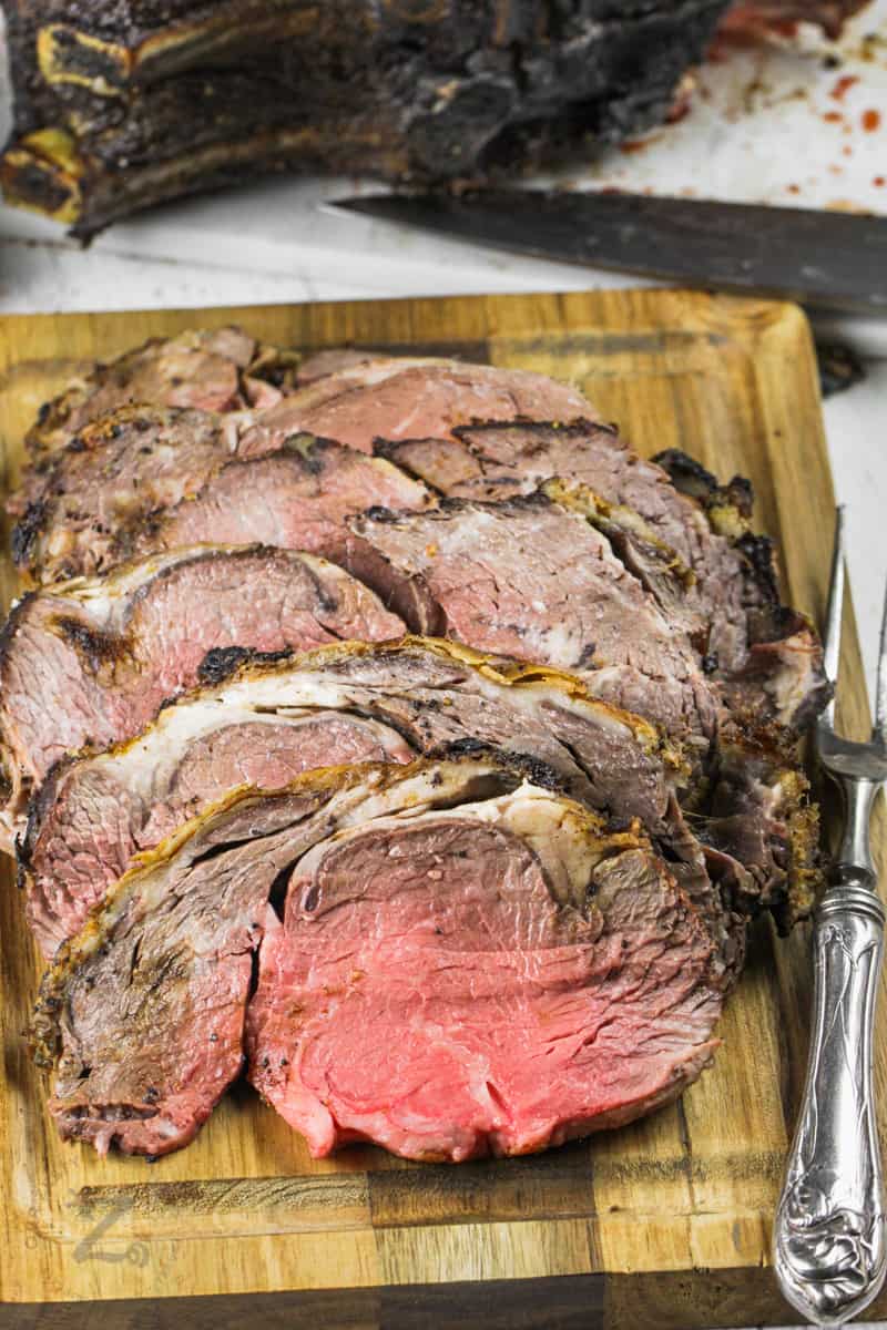 slices of Reverse Sear Prime Rib on a cutting board