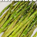close up of plated Air Fryer Asparagus with salt and a title