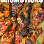 BBQ Drumsticks cooked on a baking sheet with a title