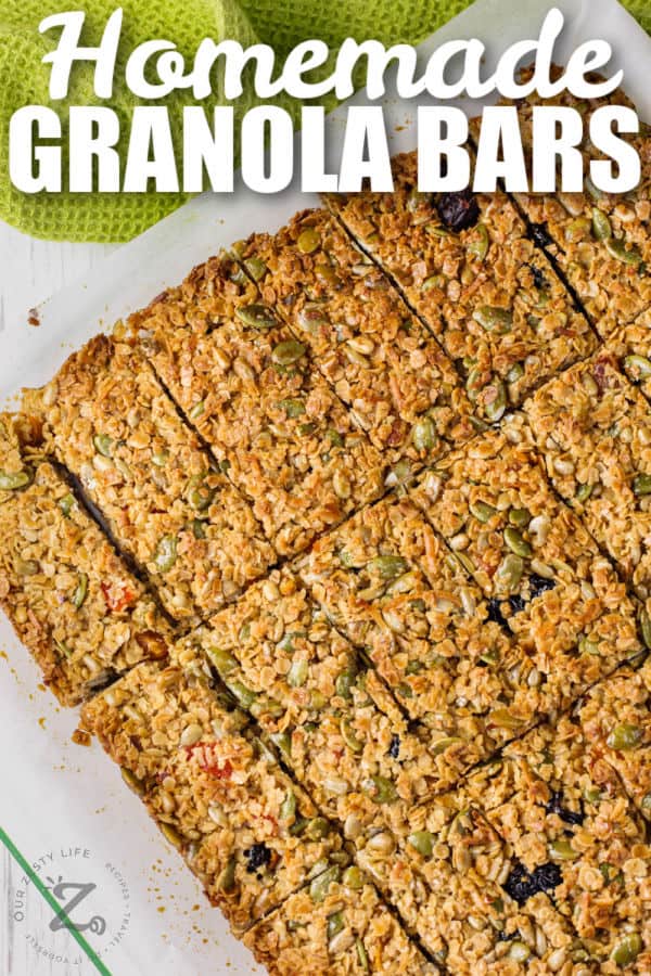 Homemade Granola Bars with Seeds sliced on a cutting board with a title
