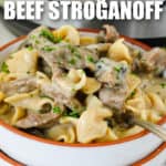 plated Instant Pot Beef Stroganoff with Instant Pot in the back and a title