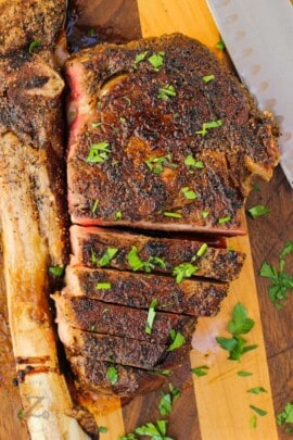Tomahawk Ribeye Steak being cut into slices