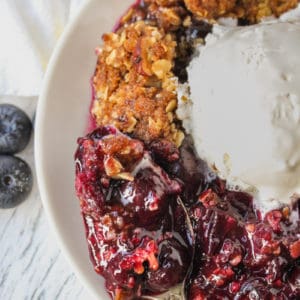 close up of Blueberry Crisp with a spoon