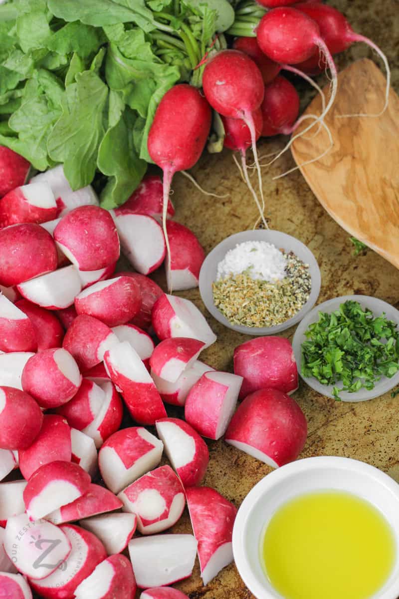 cut up radishes and ingredients in bowls to make Oven Roasted Radishes