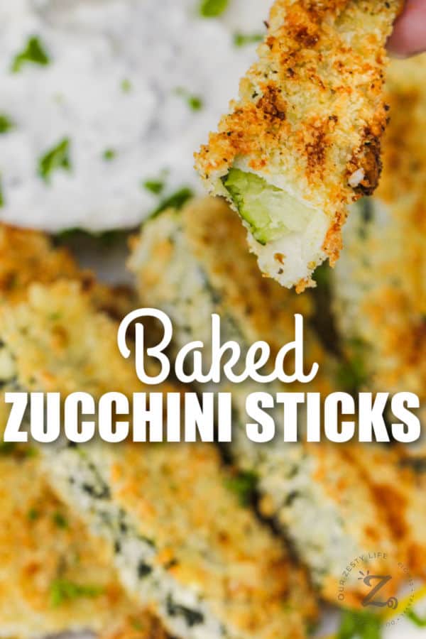 close up of Baked Zucchini Sticks with a bite taken out and writing