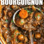 close up of Beef Bourguignon in the pot with a spoon and a title