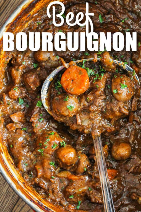 close up of Beef Bourguignon in the pot with a spoon and a title