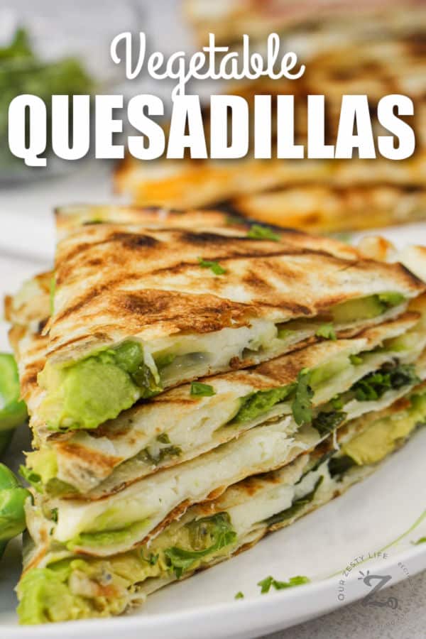 veggie quesadillas on a plate with writing