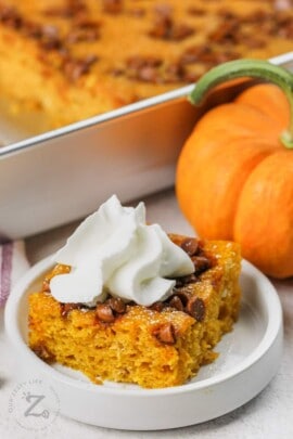 plated Easy Pumpkin Bars with whipped cream on top