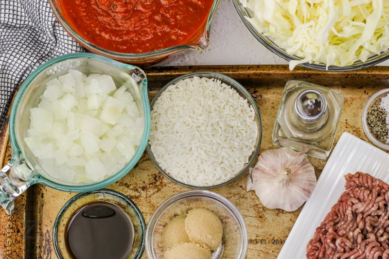 ingredients on a baking sheet to make Unstuffed Cabbage Roll Casserole