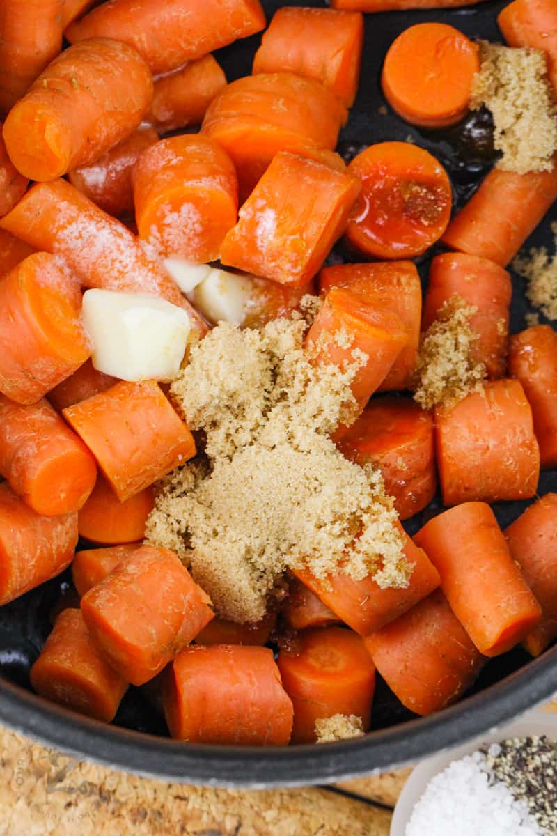 adding brown sugar and butter to carrots to make Brown Sugar Carrots