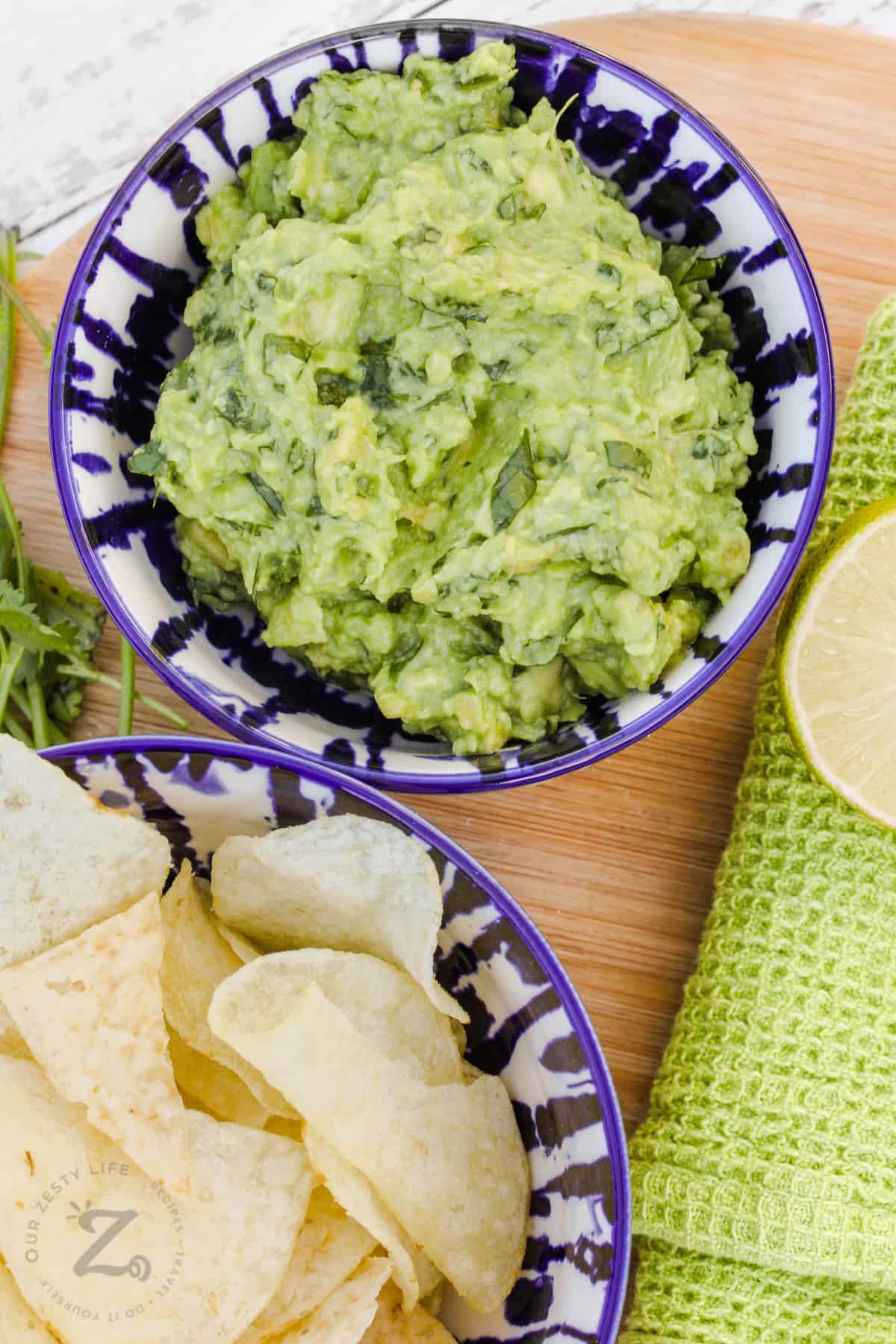bowl of Easy Homemade Guacamole and bowl of chips