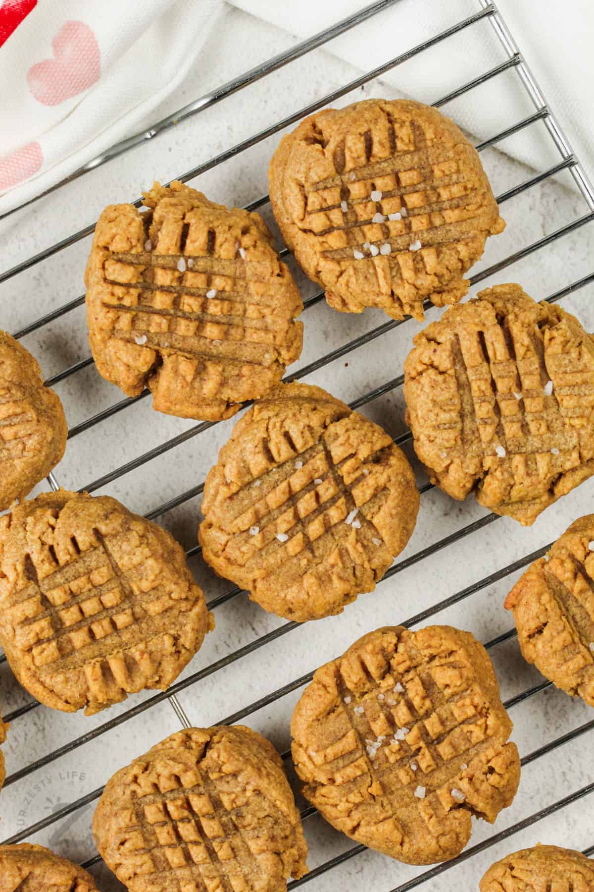 close up of Flourless Peanut Butter Cookies on a cooling rack