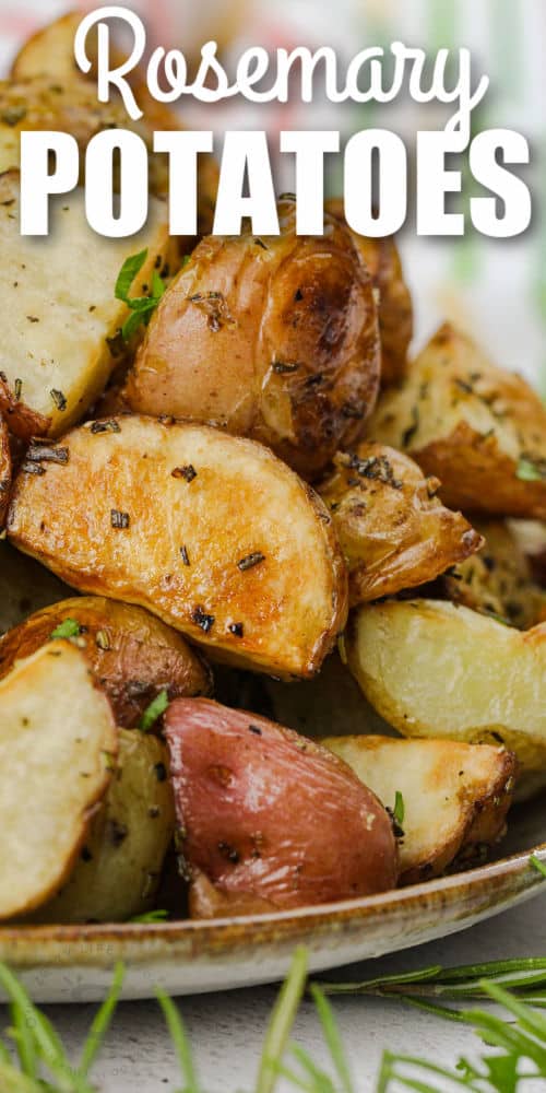 close up of Rosemary Potatoes on a plate with a title