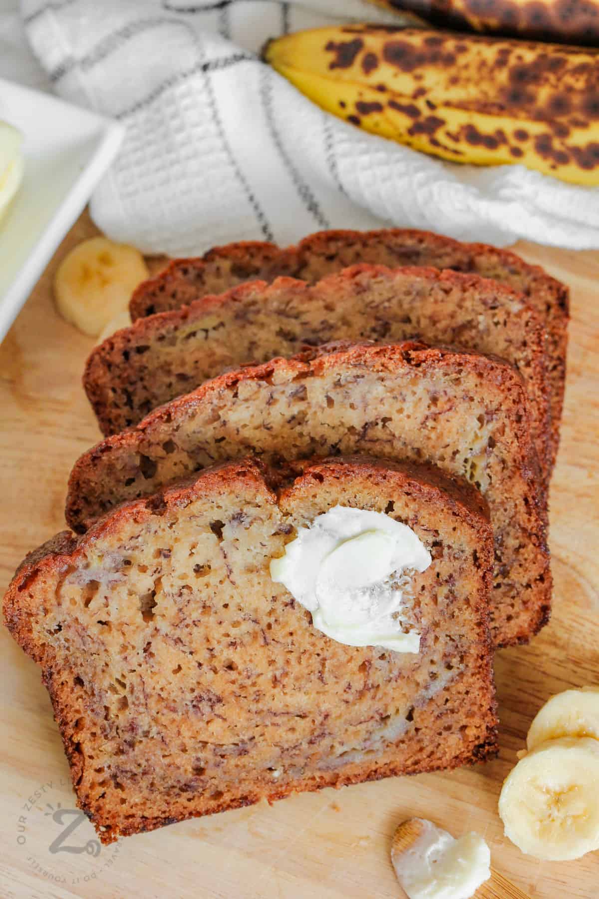 slices of Nut-Free Banana Bread with butter on it