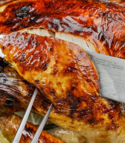 close up of knife slicing Roast Turkey