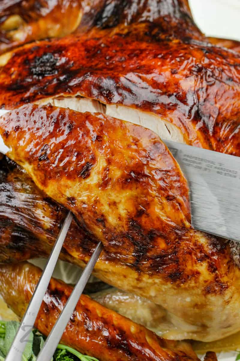 close up of knife slicing Roast Turkey