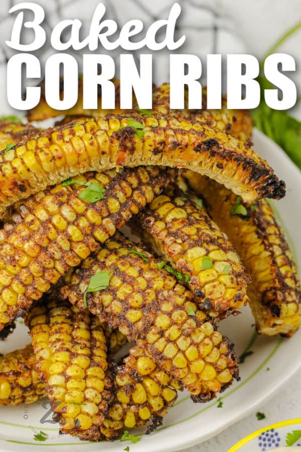 close up of Baked Corn Ribs on a plate with writing