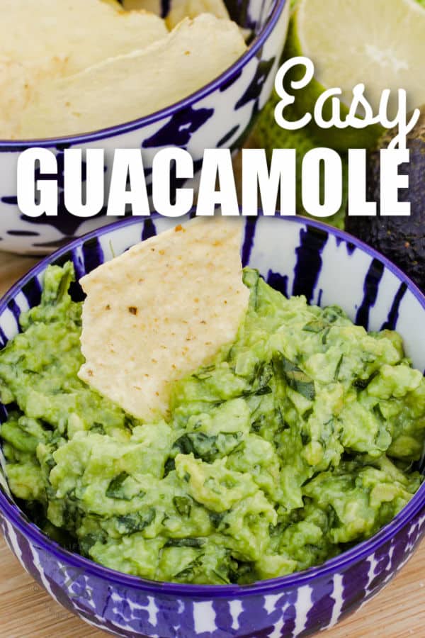 Easy Homemade Guacamole in a bowl with a chip and writing