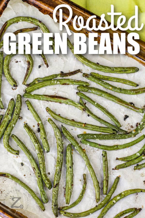 Roasted Green Beans cooked on a baking sheet with a title