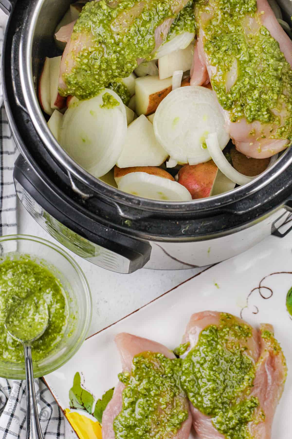 adding chicken and sauce to instant pot to make Instant Pot Chicken and Potatoes