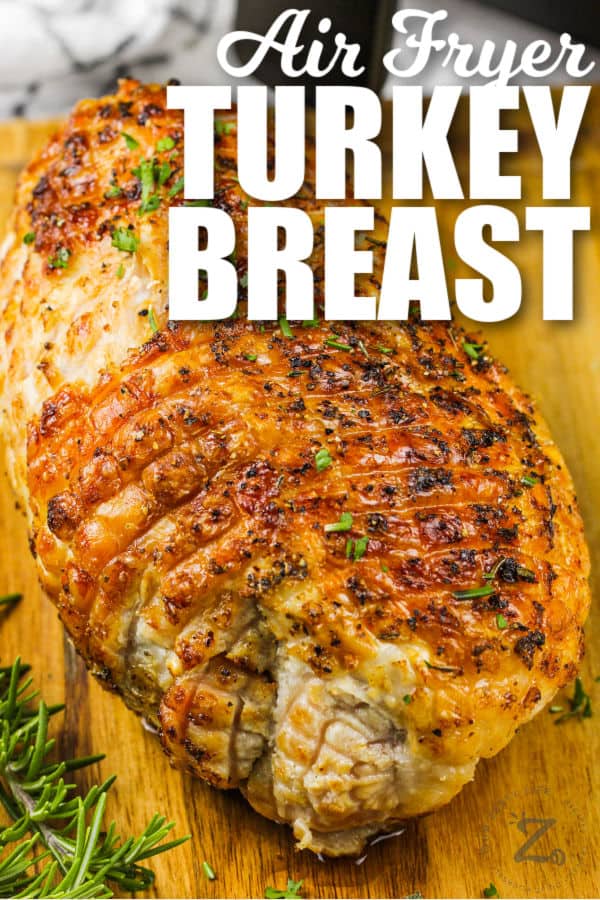 cooked Air Fryer Turkey Breast Roast on a cutting board with writing