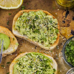 slices of Avocado Toast with ingredients around it