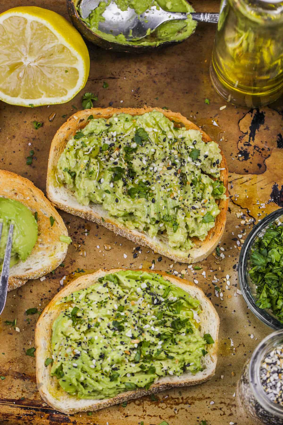 slices of Avocado Toast with ingredients around it