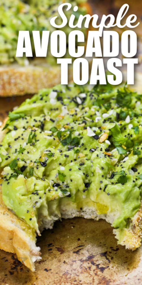 close up of Avocado Toast with a bite taken out and a title