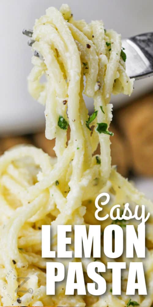 Simple Lemon Parmesan Pasta on a fork with writing