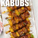 plate full of Sausage Pineapple Kabobs with writing